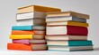 © Julia - Varied cover hardcover books are stacked on a plain white background