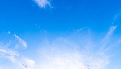 Wall Mural - clear blue sky with soft white clouds, natural background for summer themes, peaceful landscapes, ec