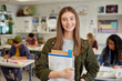 © Rido - Smiling student girl in classroom at high school