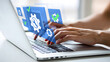 © MD AL AMIN - Hands typing on a laptop computer with digital interface and gears overlay