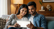 © Yash - Happy couple relaxing on couch with tablet