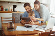 © Geber86 - Young family using a digital tablet in the morning