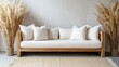 © Soonwiin - Elegant white sofa with decorative pampas grass against a neutral wall