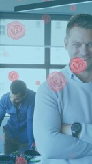 Wall Mural - animation of flower icons over diverse business people smiling and working