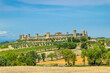 Monteriggioni medieval walls rising above Tuscan landscape in summer