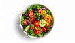 © Lucky - Overhead view of a vibrant, colorful salad in a white bowl, featuring lettuce, tomatoes, cucumbers, olives, peppers, and red onions.