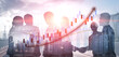© InfiniteFlow - A captivating image showcasing silhouettes of business professionals engaging in a handshake amidst rising financial graphs and a vibrant city skyline at sunset. Impute
