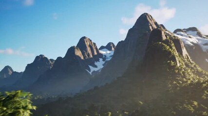 Wall Mural - Majestic Mountain Range at Sunrise Panoramic View of Peaks and Lush Greenery