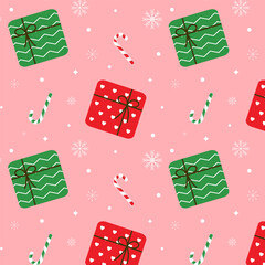 Wall Mural - Seamless Christmas pattern with colorful gift boxes in red and green, candy canes and white snowflakes isolated on light red background.Vector graphic illustration wallpaper.