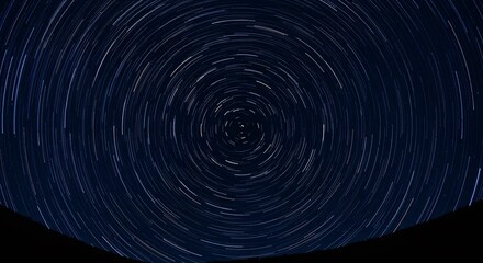 Star trails in the night sky above the horizon motion and celestial background