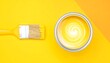 © Kiki - Paint can and brush on yellow background