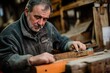 © Molly P - Skilled Craftsman Working on Wooden Furniture in Workshop Setting