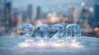 © Valentina Studio - A Glimmering Ice Sculpture of the Year 2020 Shines Brightly Against a Softly Blurred City Background, Capturing the Essence of Winter Celebrations and New Beginnings