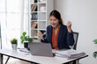 © David - Happy Asian Business woman using calculator and laptop for doing math finance on an office desk, tax, report, accounting, statistics, and analytical research concept