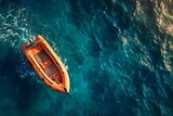 Orange inflatable motor boat sailing on deep blue water