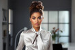© photosaint - Stylish woman poses in modern office space showcasing elegance and professionalism