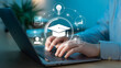 © Prosenjit - Digital Learning: A person engaging with online education through a modern laptop, surrounded by visual representations of academic icons and data streams.