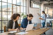© TKN - Diverse Team of Young Professionals Collaborating in Modern Office