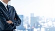 © 健 板澤 - ビジネスシーン：腕組みをするスーツを来たビジネスマンのポートレート　顔無し