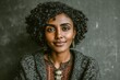 © Leo Rohmann - Captivating portrait of a young woman with natural curls embodying resilience and joy showcasing raw beauty and authenticity against a textured background radiating warmth and connection