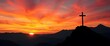 © YASUMIN - Silhouetted cross atop a mountain range at sunset, fiery sky, photography, worship