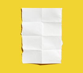 crumpled white paper sheet on vibrant yellow background highlighting texture and contrast.