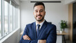 © rodrigo - Confident leader smiling latin hispanic, middle eastern business man standing arms crossed in office looking at camera. Portrait of manager executive CEO entrepreneur