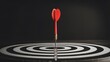 © Amena - Red dart perfectly hit bullseye on target board