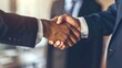 © Qggo - Professional Unity: Polished Workplace Business Handshake – Two Colleagues, Partners, or Clients Greeting with a Firm, Confident Handshake in a Modern Office Setting, Suits or Business Casual Attire