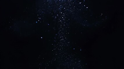 Wall Mural - abstract seamlessly looping video featuring shimmering glowing particles rising slowly on a dark bac