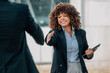 © carballo - professional business executive receiving or greeting by shaking hands