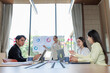 © Wanchai - Team discussing strategies for marketing and investment planning.