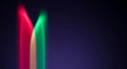 Canvas Print - Blurry Red and Green Light Streaks Against Dark Purple Background abstract blurred