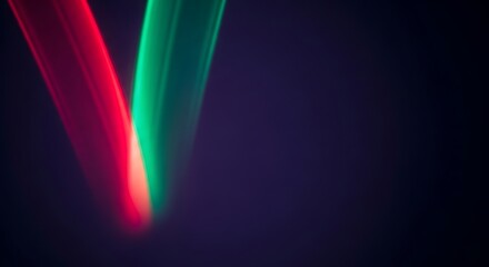 Canvas Print - Red And Green Light Streaks Against Dark Background abstract blur