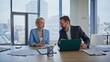 © stockbusters - Happy coworkers looking laptop discussing at office closeup. Inspired startupers