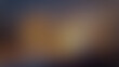 © ArtBeauty - Soft focus abstract background with warm brown and dark blue tones texture bokeh
