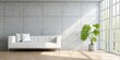 © garage - A modern, minimalist living room boasts a white couch, a concrete wall, and a lush plant by a large window.