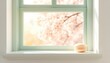 © Peerapong - Pastel window frame with blurred springtime blossom outside and a small cream colored macaron on the windowsill