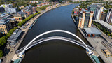 Aerial View of River Tyne with Gateshead Millennium Bridge and Cityscape  in Newcastle upon Tyne, UK