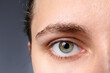 © New Africa - Woman with beautiful eyes on grey background, closeup
