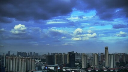 Wall Mural - Time lapse of dark stormy clouds over the city