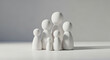 © adobe - Abstract family figurines representing unity and connection in a softly lit studio setting