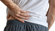 © ROWSHAN - Man holding his lower back in pain isolated on white background, suffering from backache or kidney problems medical technology