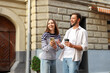 Coffee to go. Couple with paper cup of drink and smartphone outdoors, space for text