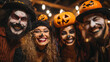 © Алексей Иванченко - Happy young people dressed up as different spooky characters, with scary makeup on faces having fun at Halloween costume party. Group portrait of adult friends with traditional smiley jack-o-lantern