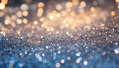The image shows an abstract background with glittering textures and bokeh lights in shades of gold and blue.