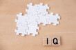 © kittyfly - wooden letters, word IQ, wooden letters, intelligence quotient on wooden background, quantitative science indicator expressing success, concept idea, level mind, intellectual achievements testing