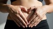 © Darmanto - Healthy Gut Woman with Hands Forming Heart on Stomach