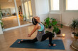 © phoenix021 - Attractive fit energetic middle aged woman doing yoga indoors , heart opener pose