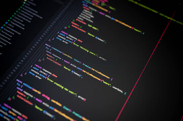 close-up of colorful programming code on a screen showing createuser function with authorization bea